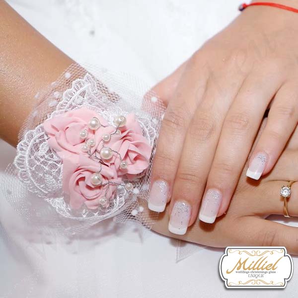 Luxury wedding boutonniere with roses for bride color ashes of roses, pearls and white lace